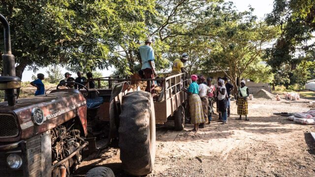 Women lining up to get supplies for building their water supply system