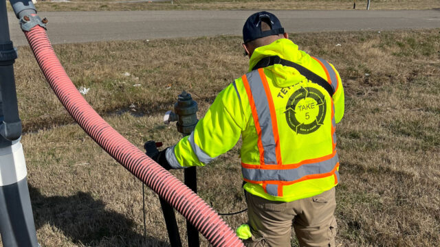 Field technician performing surface emissions monitoring