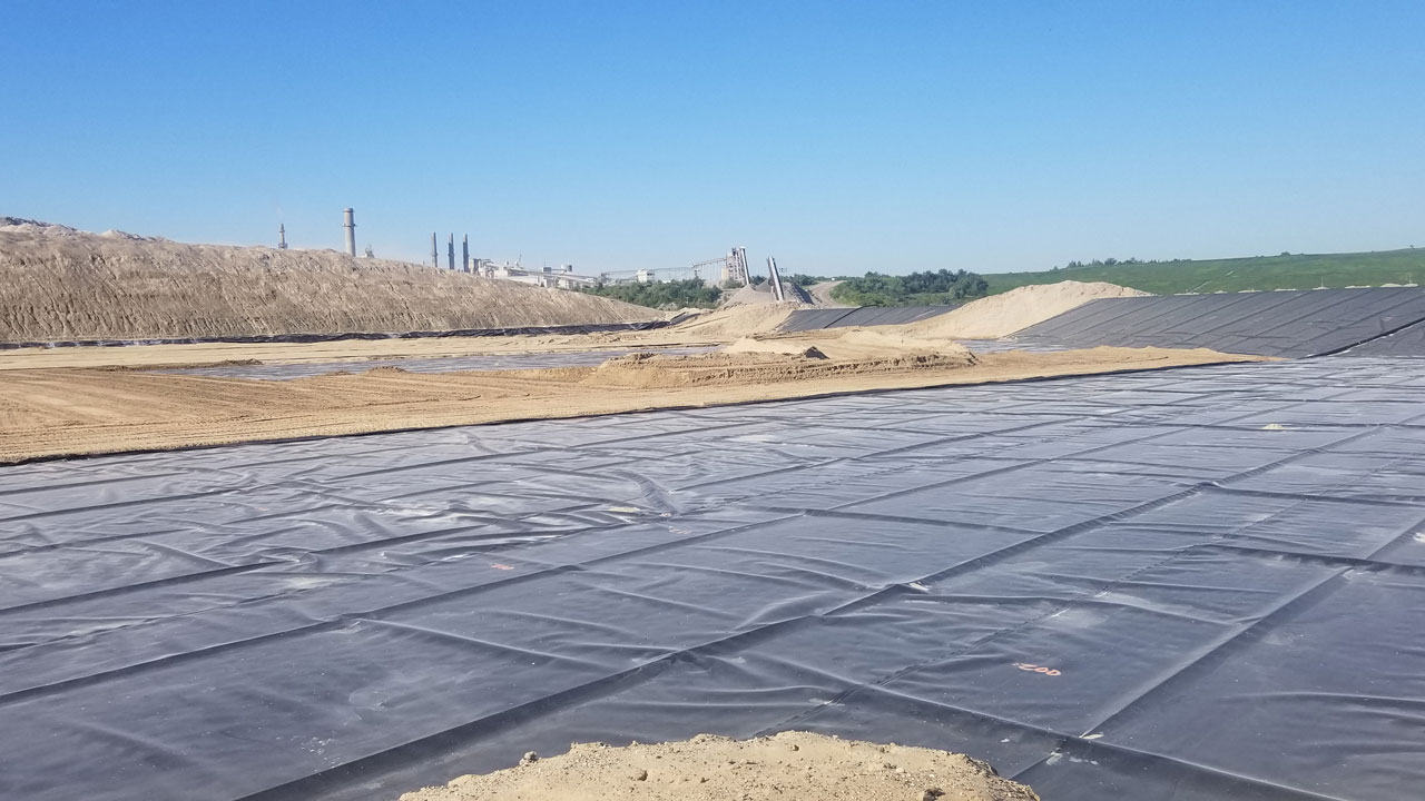 Liner panels at Type III CKD landfill, (cell 7) operational cement plant, and landfilled CKD material