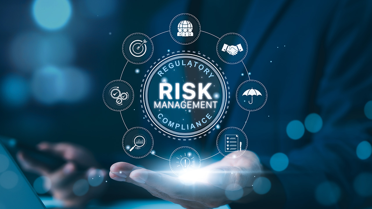 Digital illustration of a hand holding glowing icons representing regulatory risk management and compliance concepts