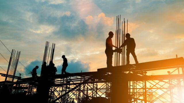 Construction workers on a steel building framework