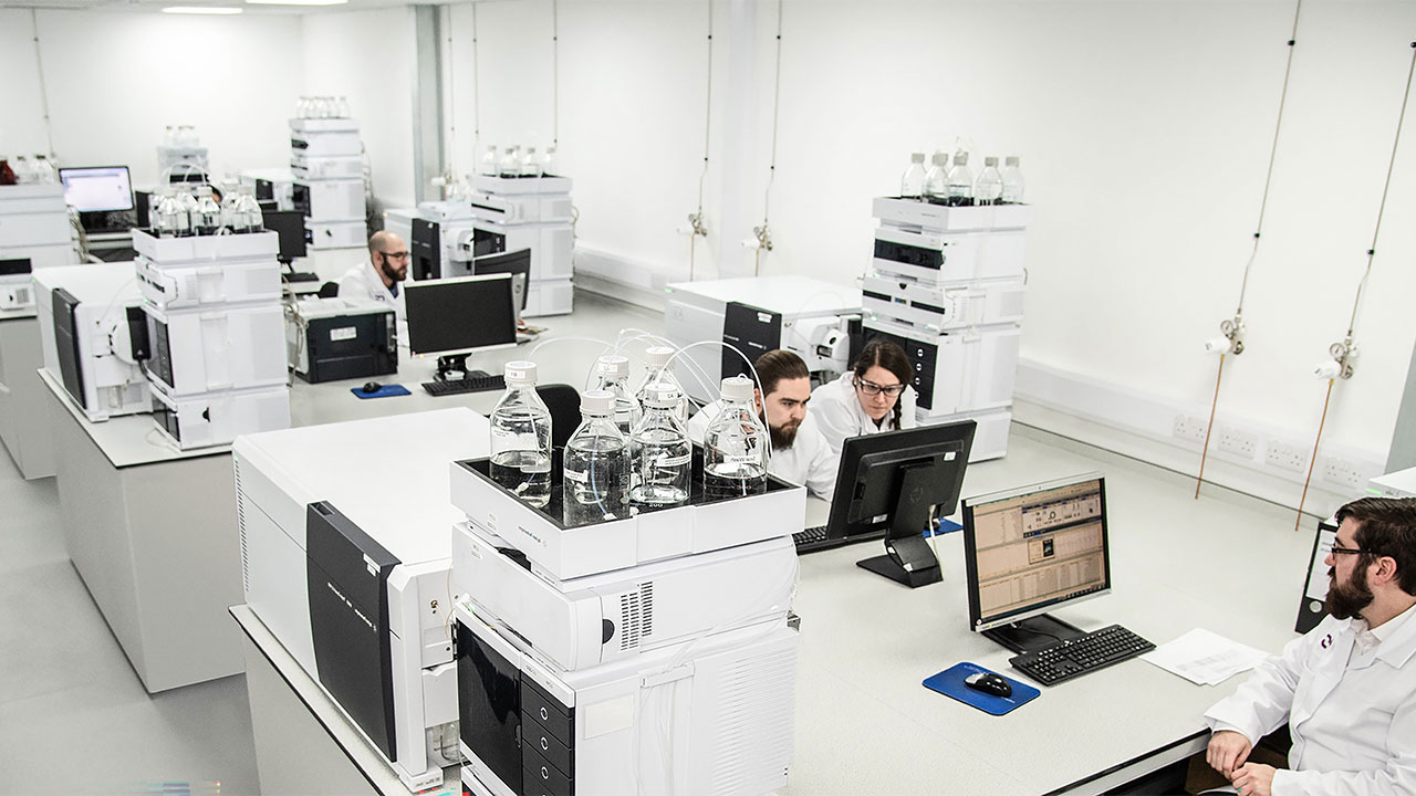 A group of laboratory scientists in an office environment in Bedford