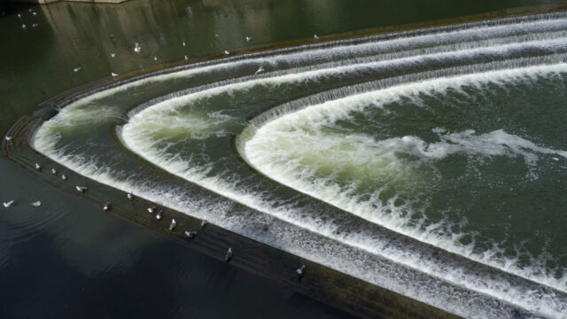 View of river flowing into a dam
