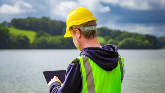 Portrait of a male maintenance engineer working outdoors at the reservoir