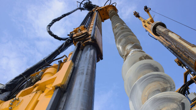 Drilling rig looking up at the mast and drill rod