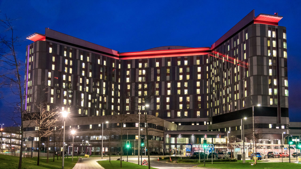 Exterior view of hospital building at night