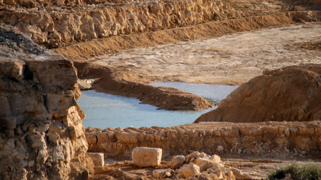 Close view of quarry pool and rock layers in Corby, England, United Kingdom