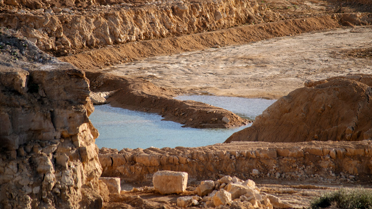 Close view of quarry pool and rock layers in Corby, England, United Kingdom
