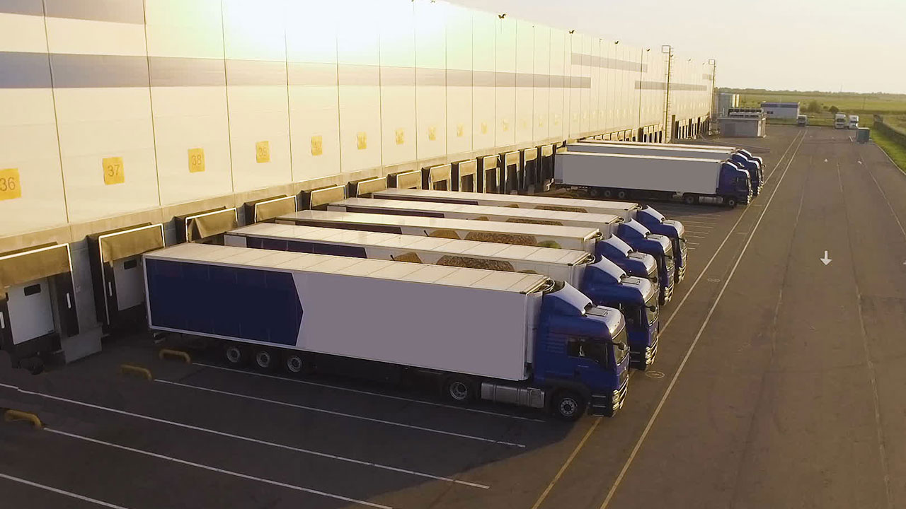 Lorries lined up at a warehouse loading bay