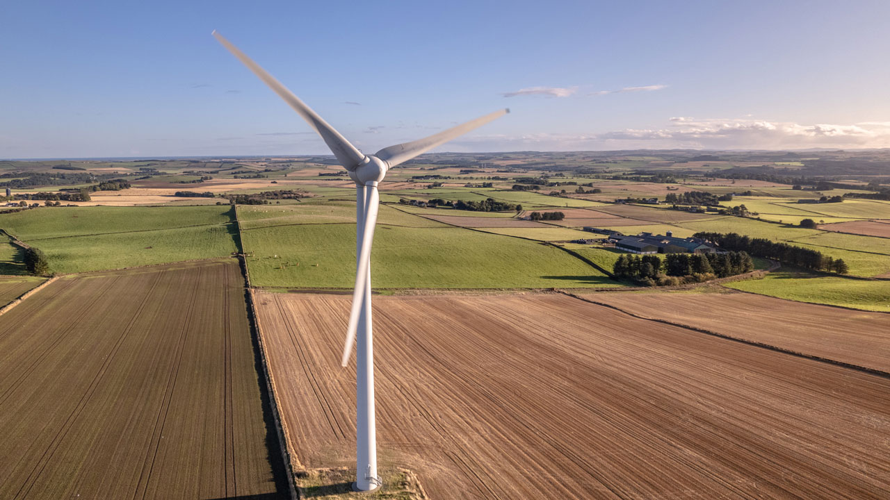 Wind turbine on a farm on a sunny day in Scotland