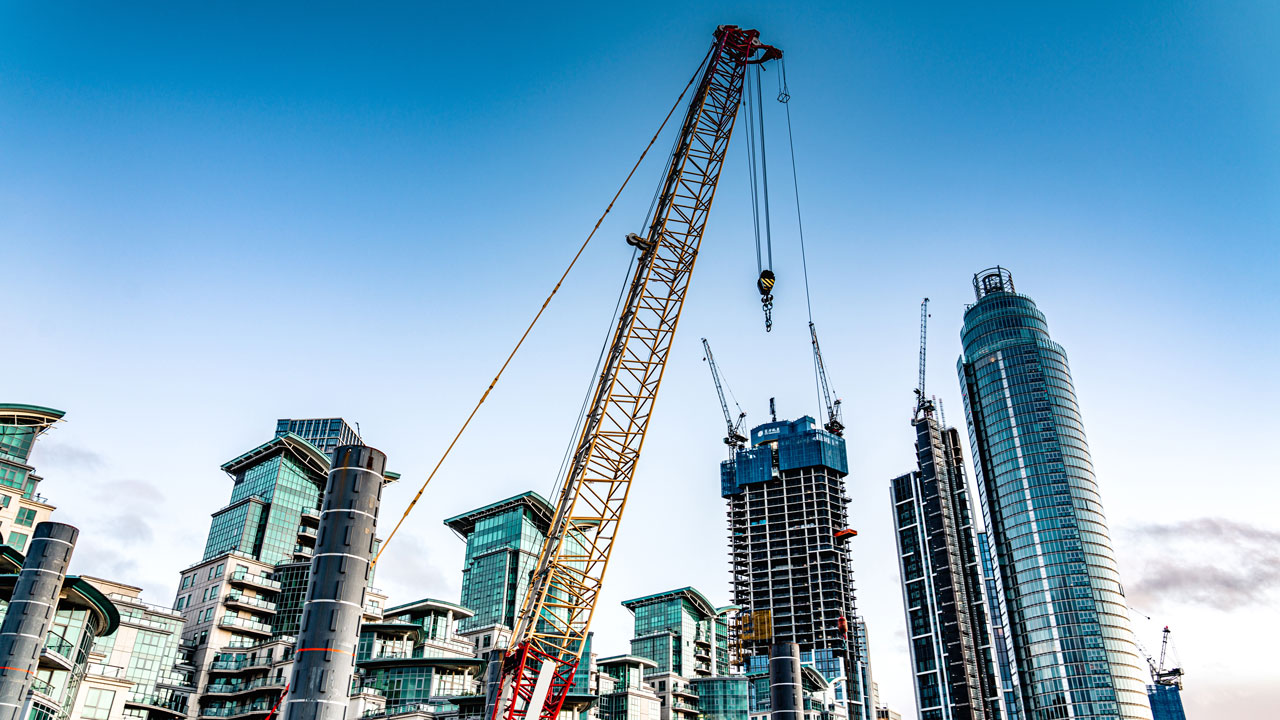 City skyline with high rise buildings and construction crane