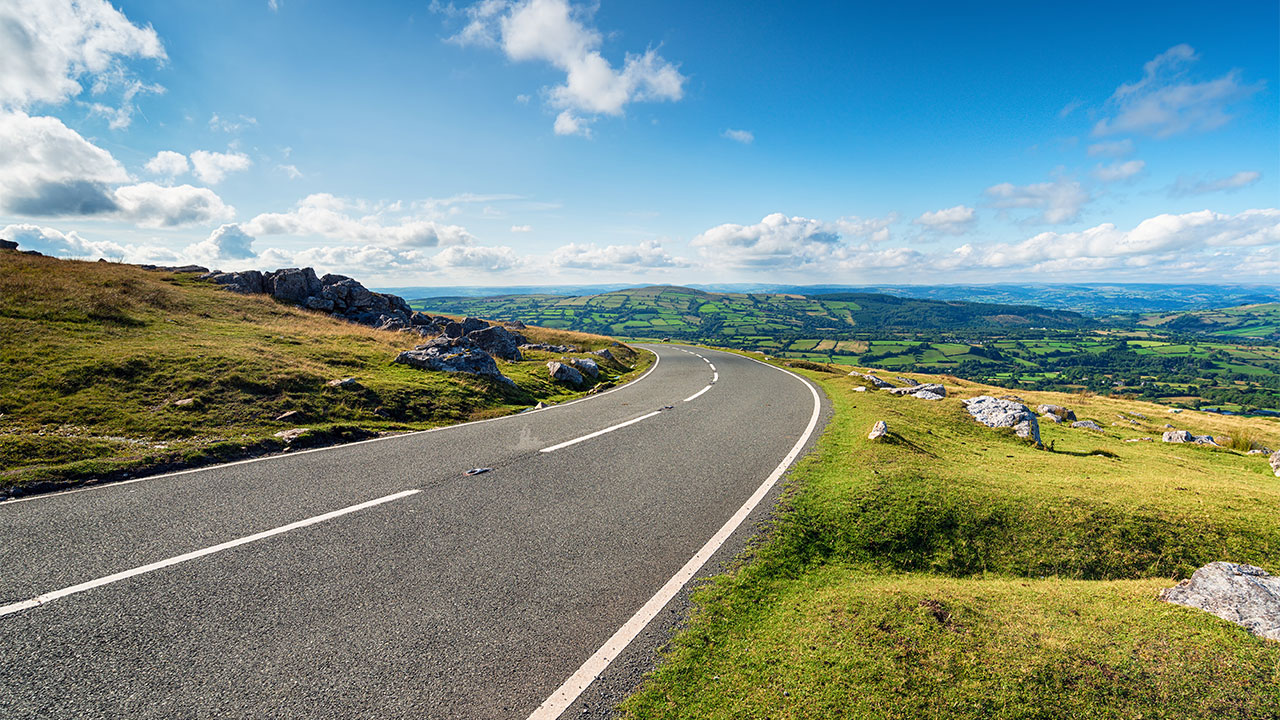 A main road with roadworks cutting through the beautiful Welsh countryside