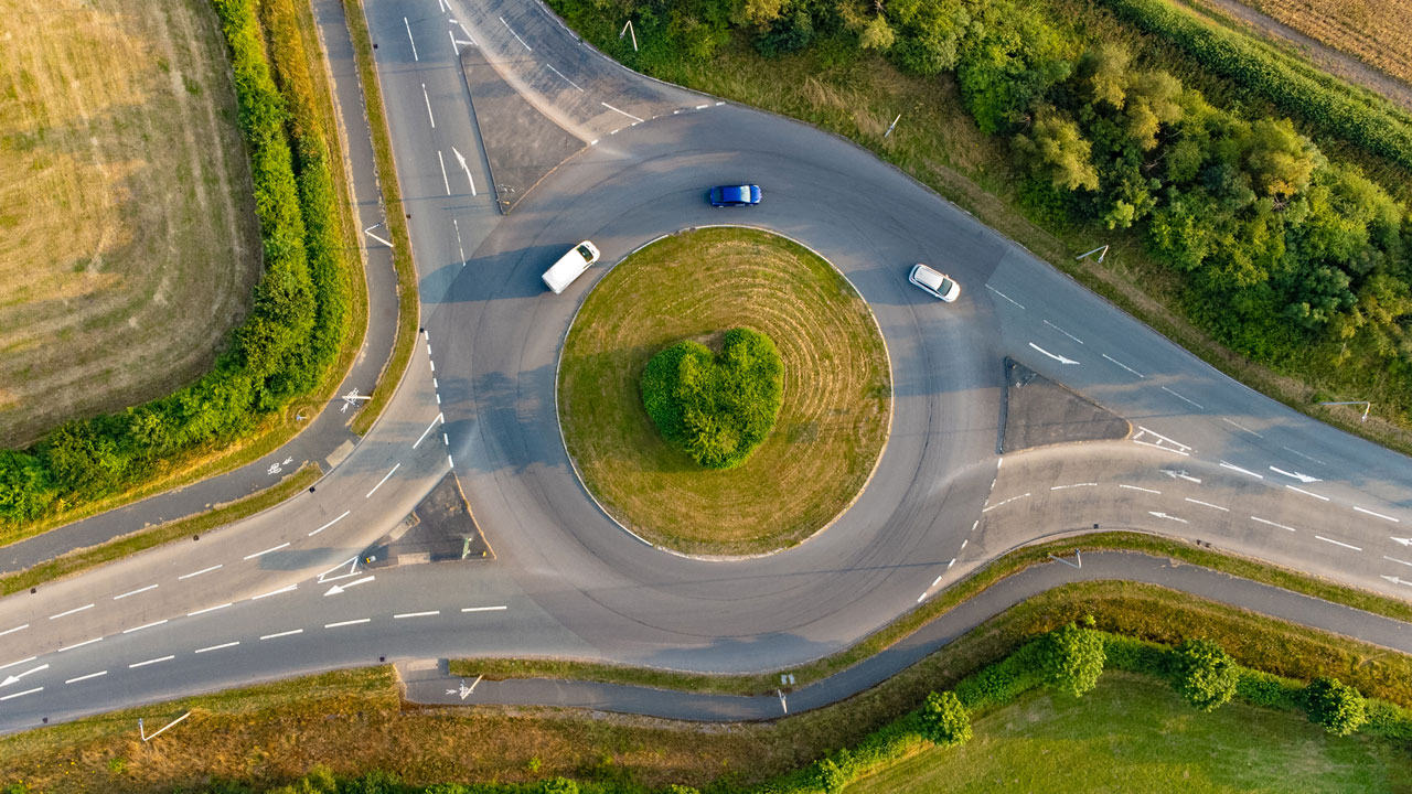 Aerial view of cars on a roundabout