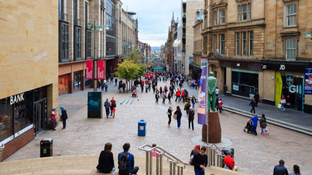 People in a pedestrianised city centre retail street