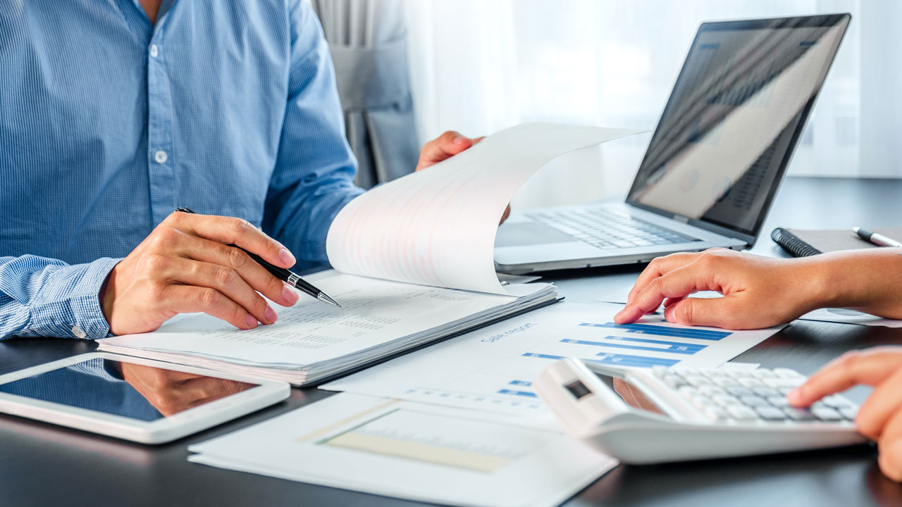 Business people reviewing documents together