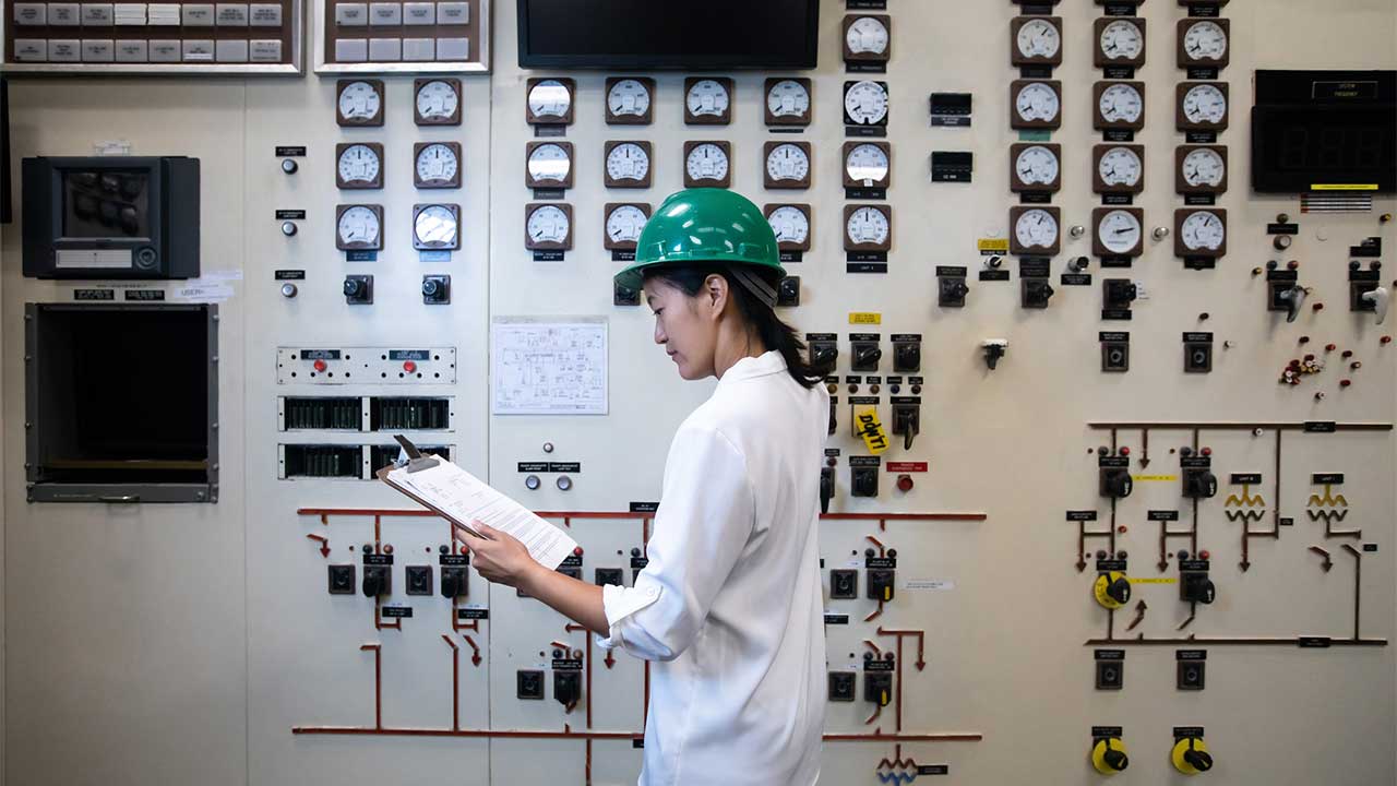 A worker in a control room of a natural gas fired power plant
