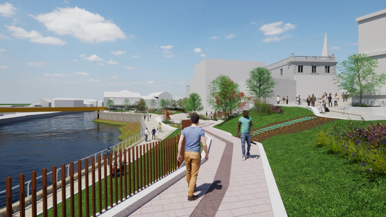 A digital rendering of a riverside park with walking paths, green lawns, trees, and people strolling along the waterfront under a blue sky with scattered clouds