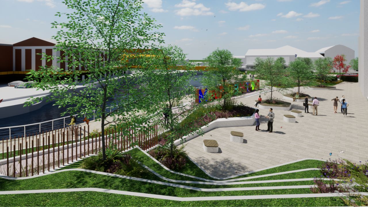 A digital rendering of a riverside urban park with paved walkways, green grassy terraces, trees, benches, people walking and socializing, and colourful letters spelling “Rotherham" near the water