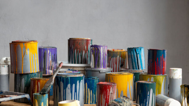 Used paint cans stacked together