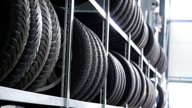 Car tyres on racks in a warehouse