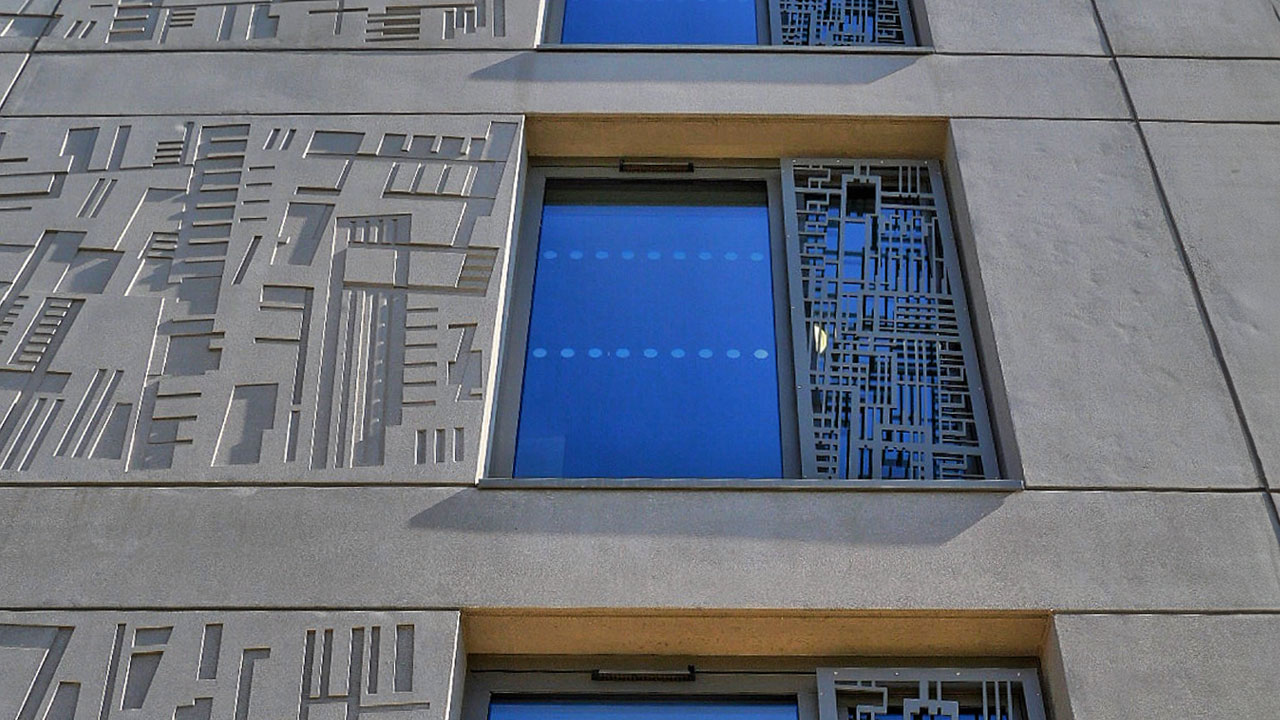 Closeup photo of the windows and concrete wall designs of the University of York dorm building