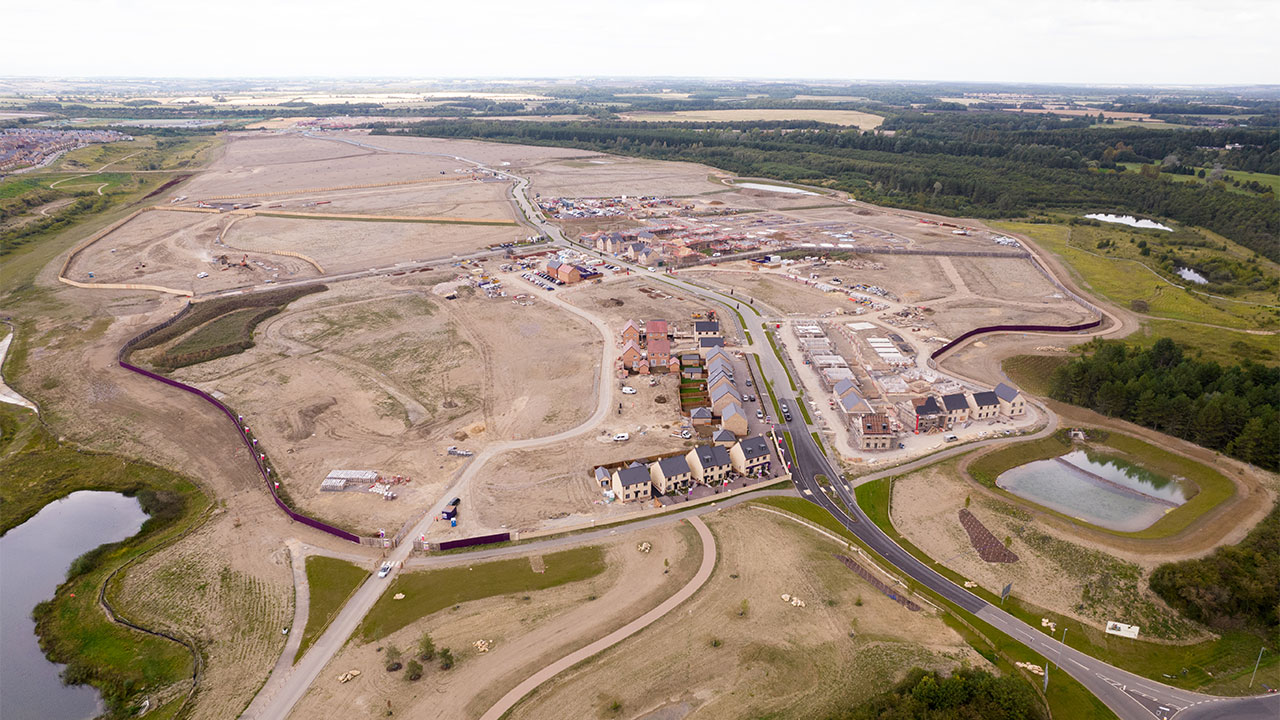 Aerial view of housing development in construction – Priors Hall Park, Corby