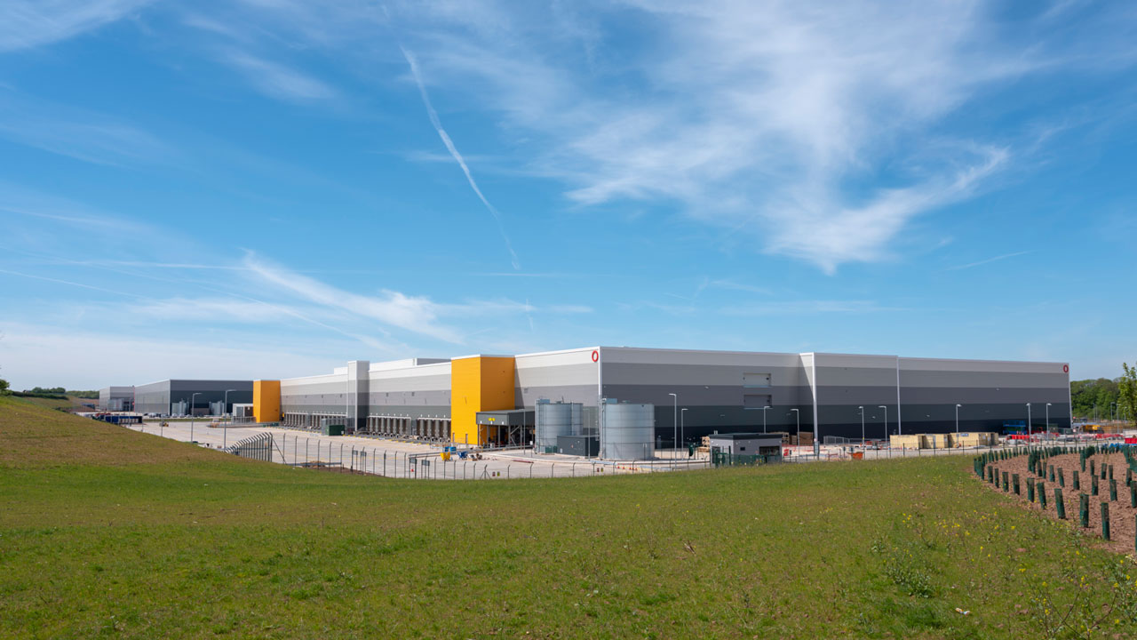 Exterior of SEGRO Logistics Park, industrial units with blue sky background