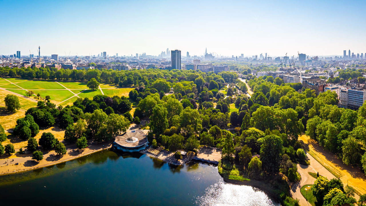 Aerial view of Hyde park in the morning with London skyline in the distance
