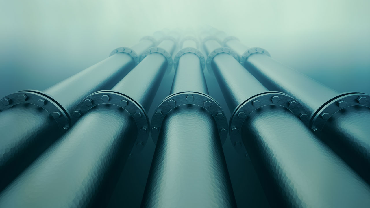 A row of five large underwater gas pipes