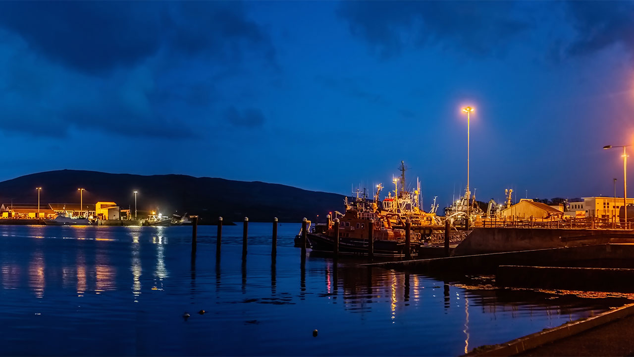 Ocean view of Dinish Wharf at night