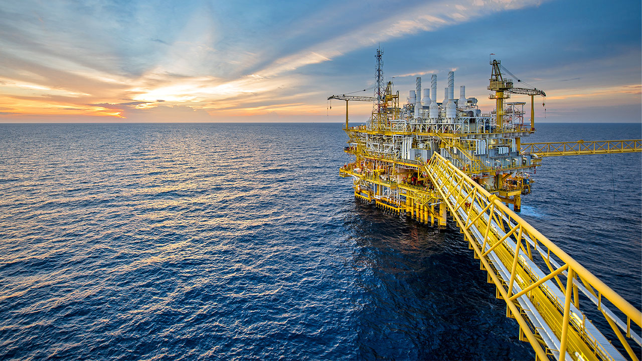 A drilling rig and platform used in the oil and gas industry for offshore fuel exploration