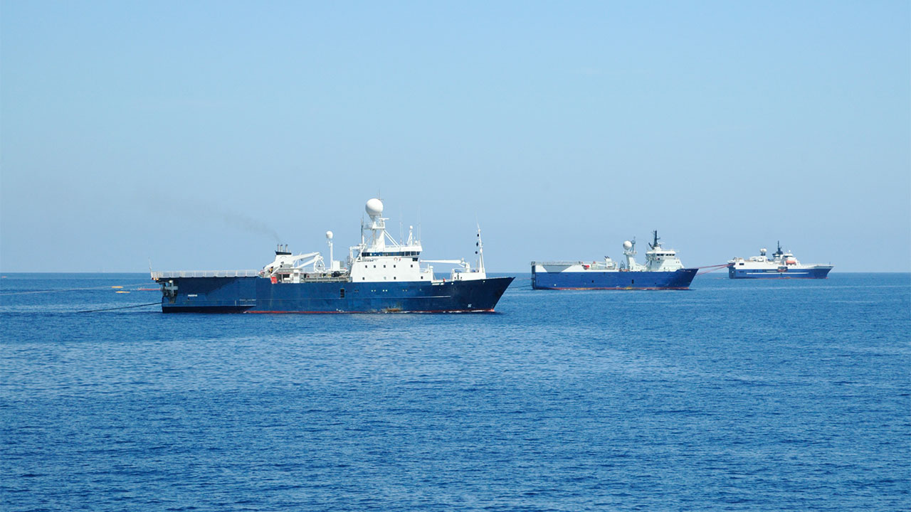 Image of three seismic survey ships at sea