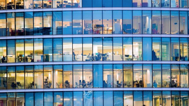 View of offices in a block illuminated at night