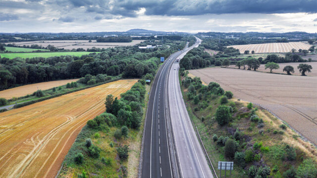 Aerial view of dual carriageway between farm fields