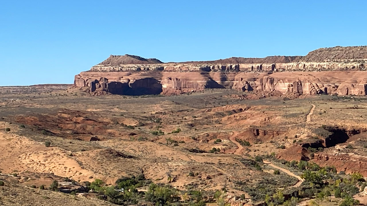 Red sandstone cliffs of Utah under a clear blue sky