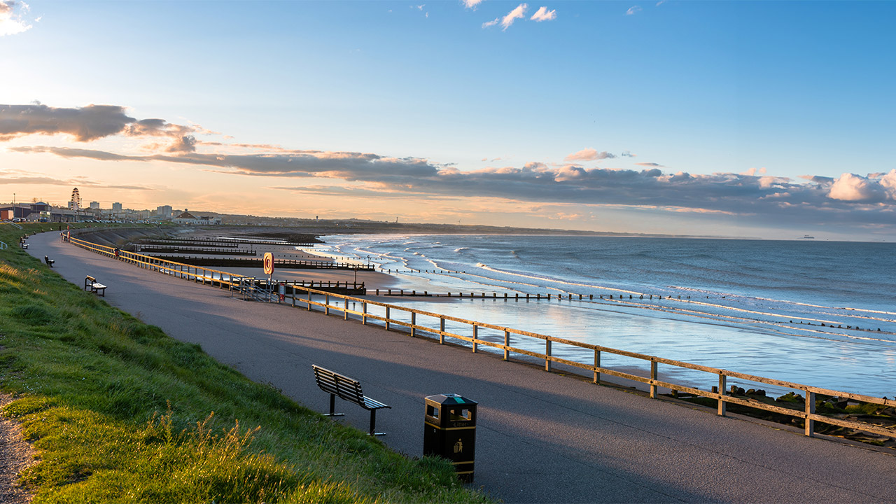 A view of the beach at Aberdeen, with the town on the horizon