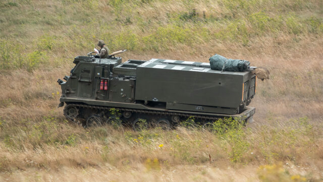 Photo of an army military vehicle firing a missile