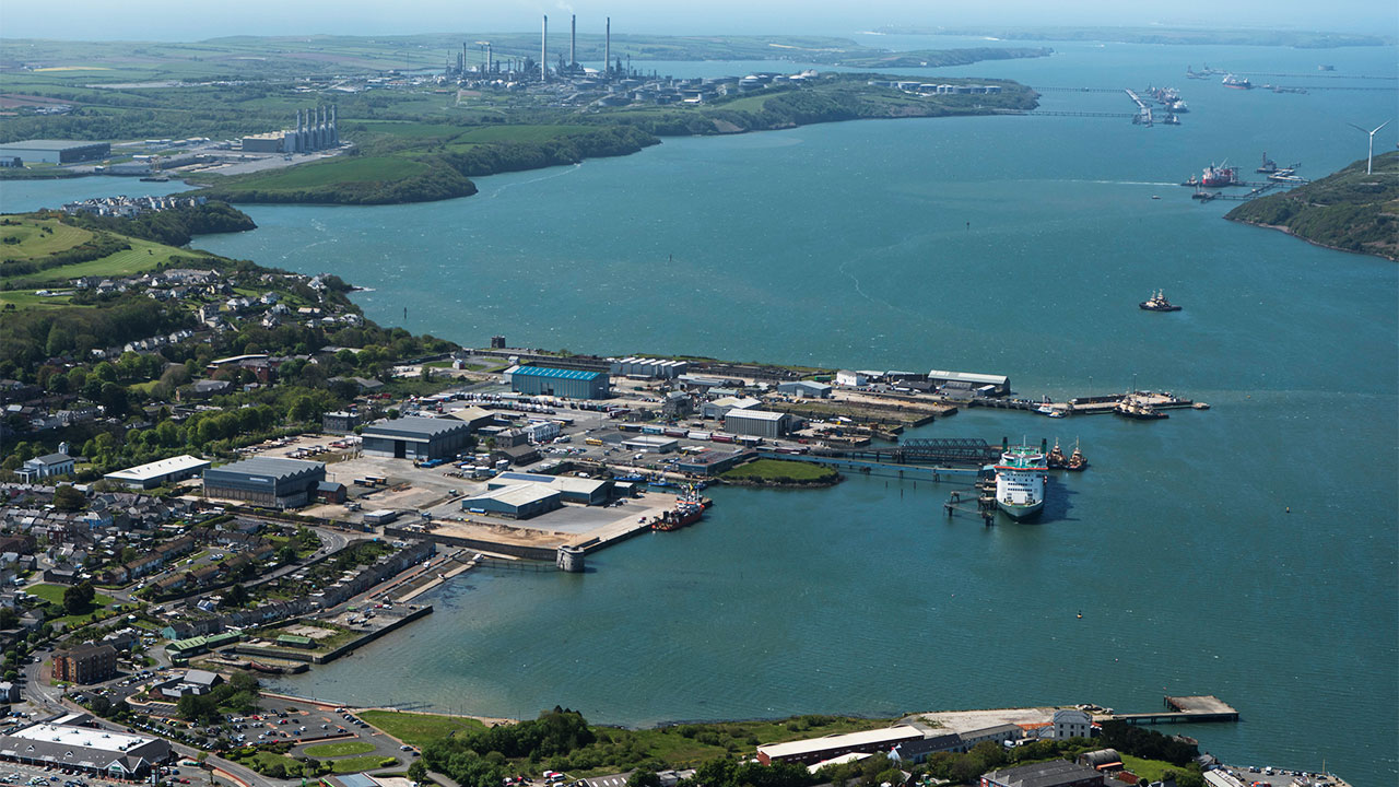 An aerial view of Pembroke Port showing industrial facilities and a large ship in the foreground