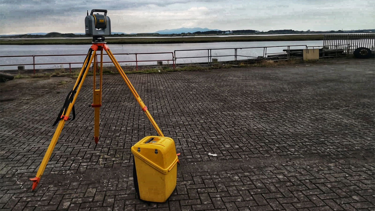 Geospatial Surveying equipment with view of Irvine Harbour in background