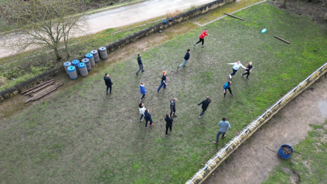 Aerial view of a group of people playing a game on a field