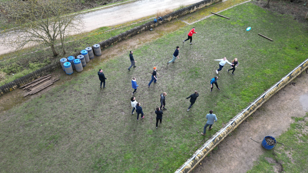 Aerial view of a group of people playing a game on a field