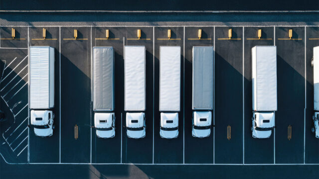 Birds-eye view of lorries parked in a designated parking zone