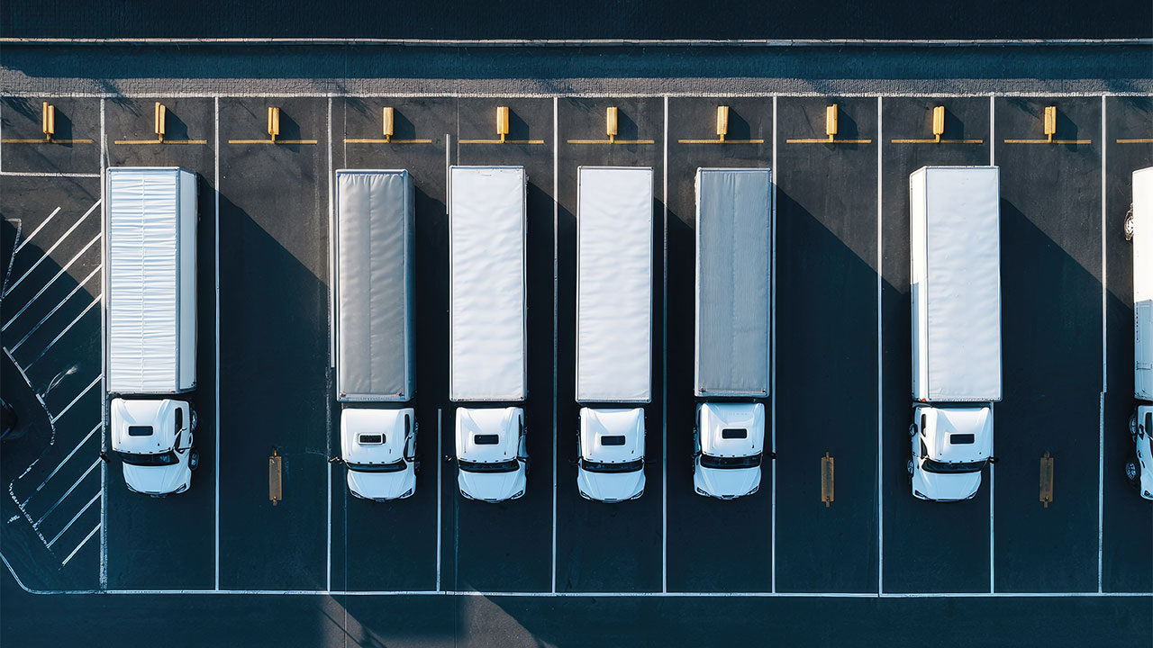 Birds-eye view of lorries parked in a designated parking zone