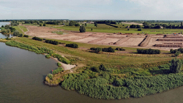 Aerial view of a river and a dike