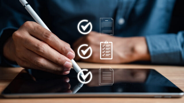 Hand using a stylus on a tablet screen with floating checklist and document icons