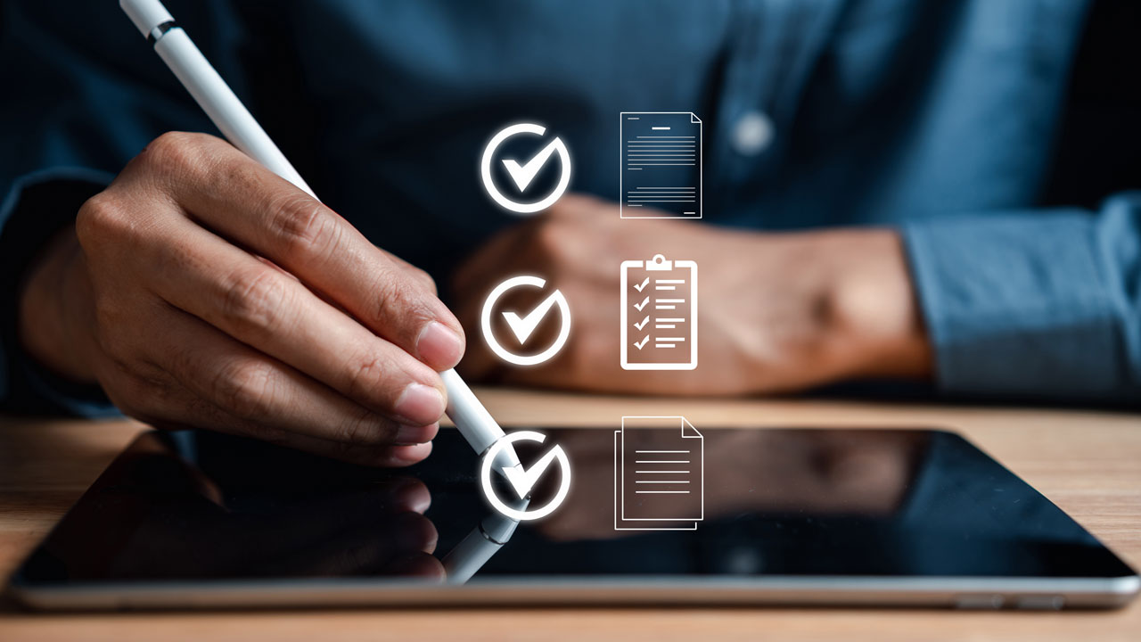 Hand using a stylus on a tablet screen with floating checklist and document icons