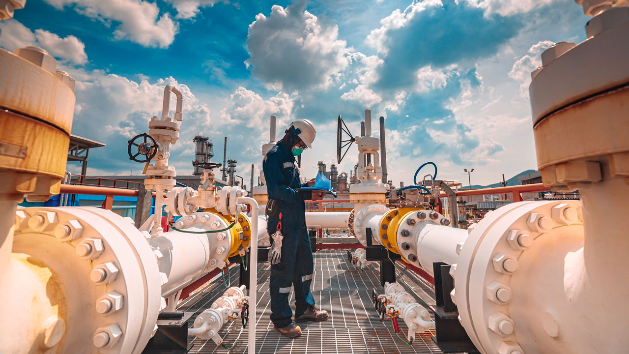 A person working near gas pipes