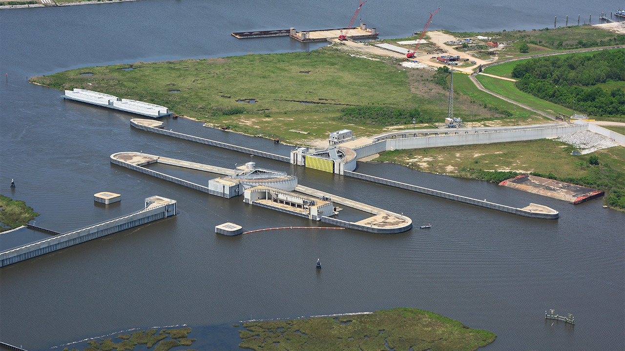 Aerial view of the IHNC Surge Barrier showing interconnected floodgates, navigation structures, floodwalls, and other coastal infrastructure assets