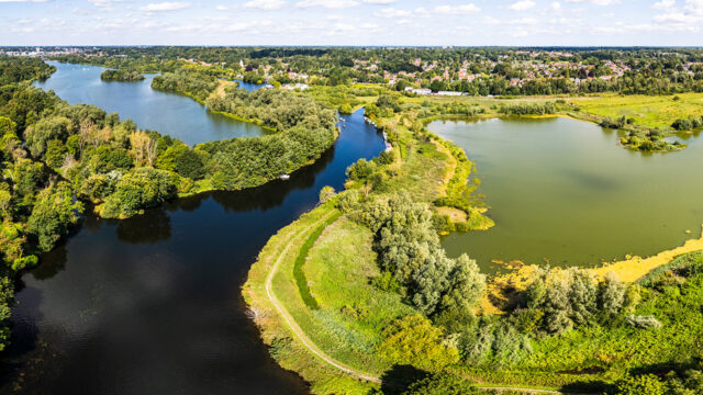 Aerial view of River Yare bending around Whitlingham Broad, Norfolk