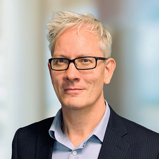 Headshot of Ola Holmstrom